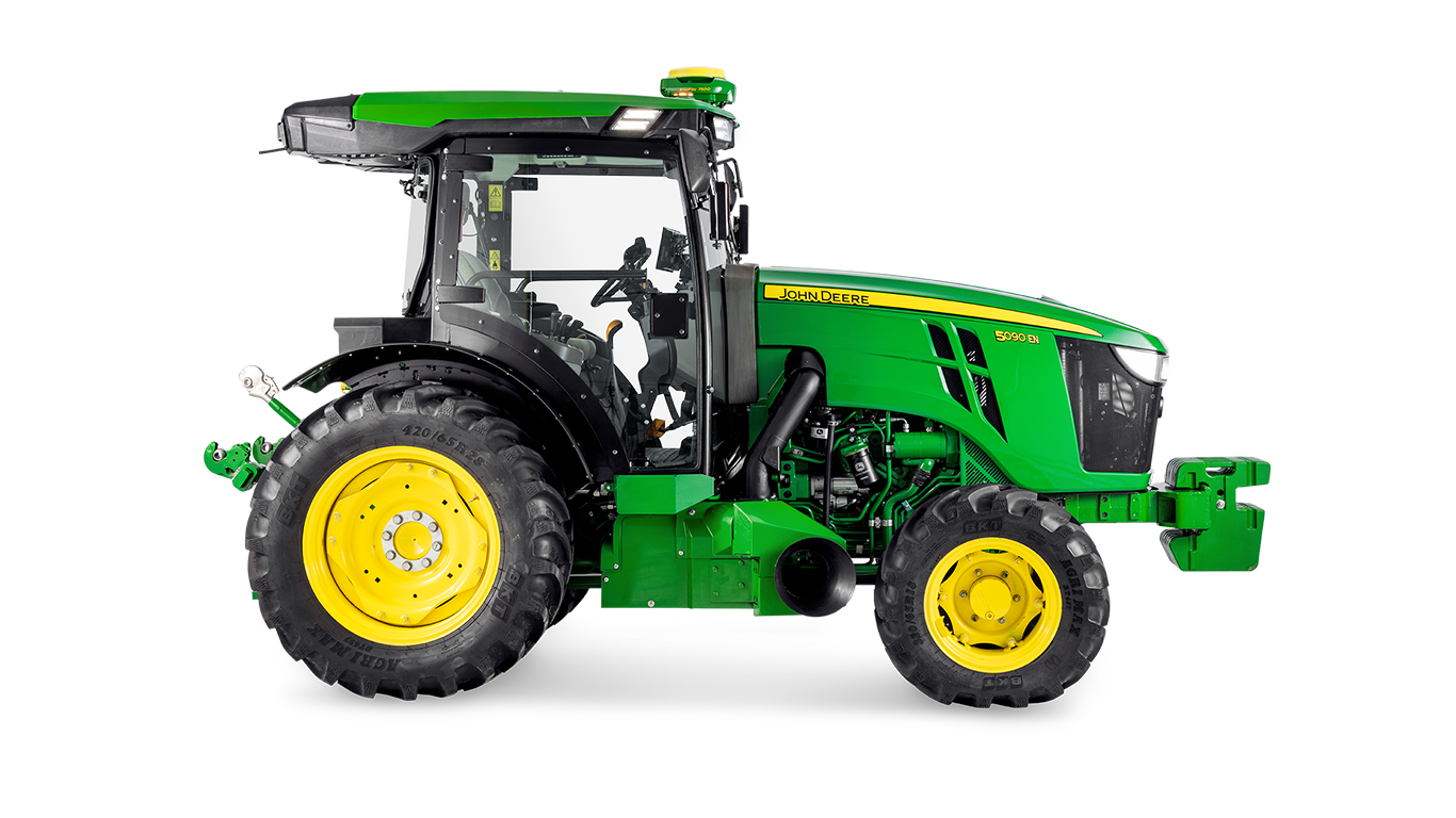 A John Deere 5090EN traktor oldalprofilja, amely a fülke kialakítását és a nagy hátsó gumiabroncsokat emeli ki.
